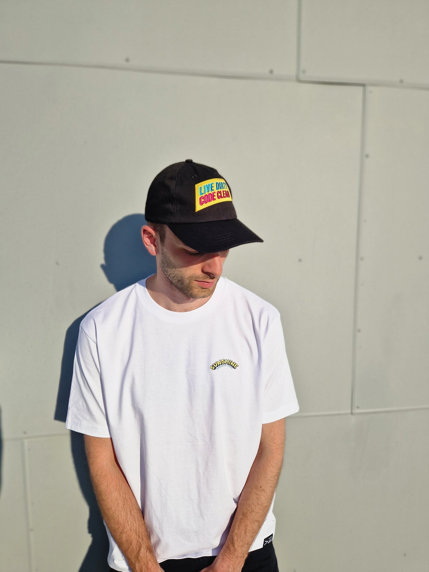 Men wearing black Programmer Cap and Coder t-shirt from Clean Coder Club